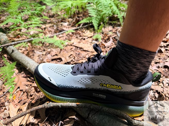 Stepping on a branch during testing, noting the impact absorption of the Cascadia 20