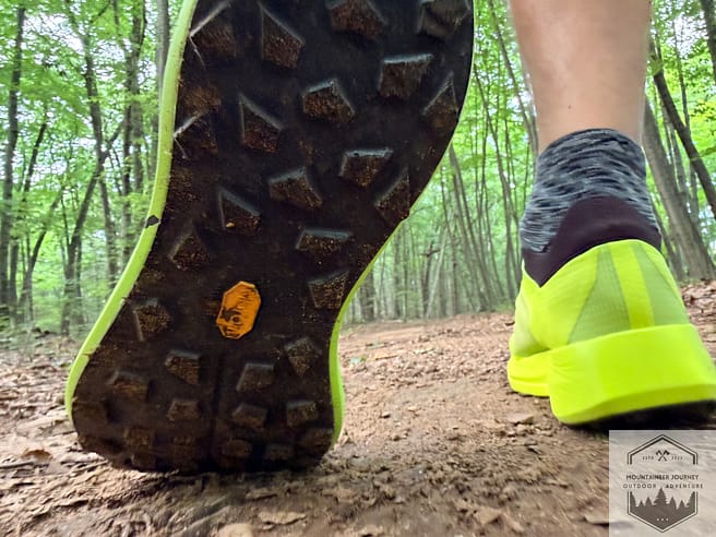 View of the Vibram LightBase outsole with some mud during testing between each lug