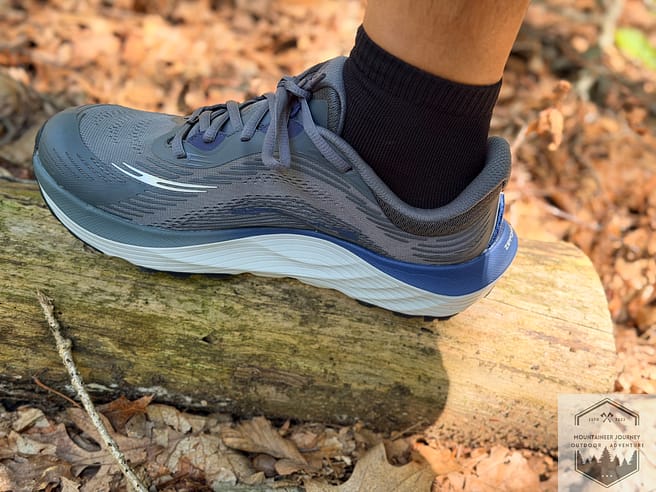 Shoes resting on a log