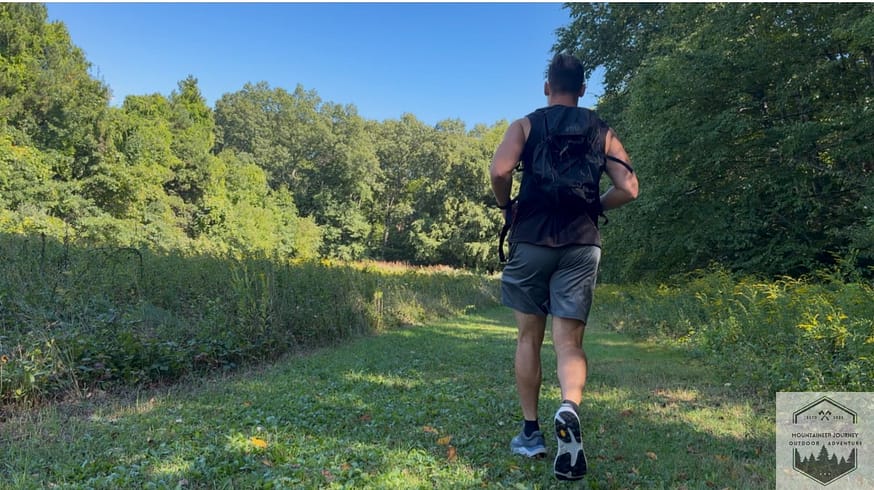 Running on grass Trail connecting to single track while testing out the Topo Ultraventure 5