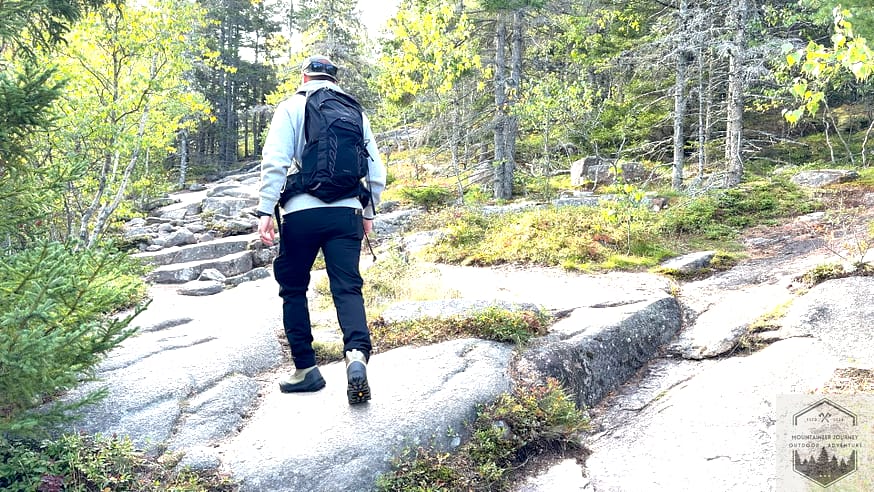 Hiking across granite slabs with Konseal boots during testing