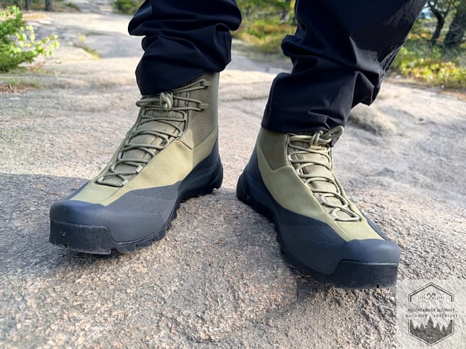 Front view of both boots while standing on granite