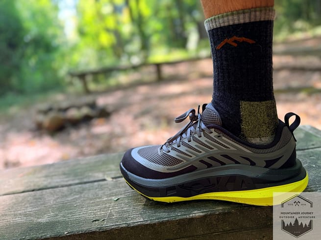 Hoka Stinson 8 on a trail bench Noting the stack height.