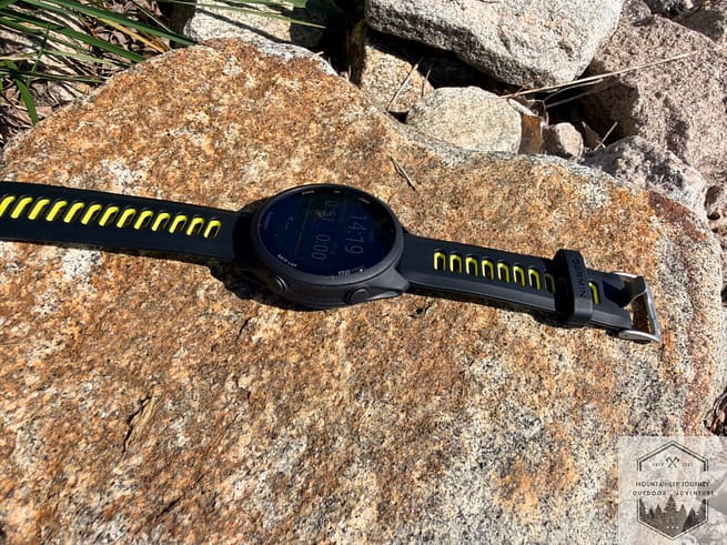 Side view of watch band on rock