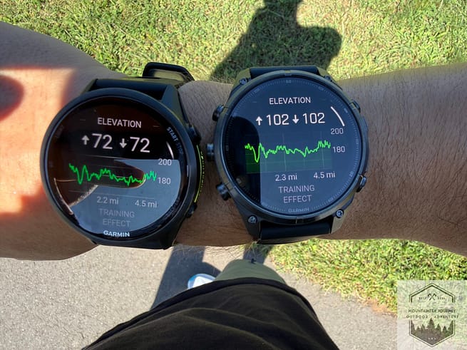 Both Garmin Fenix 9 and Forerunner 970 watch faces during an exact run, showing elevation variances
