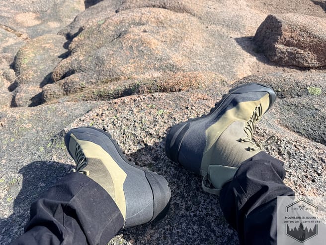 View of boots while resting at top of summit