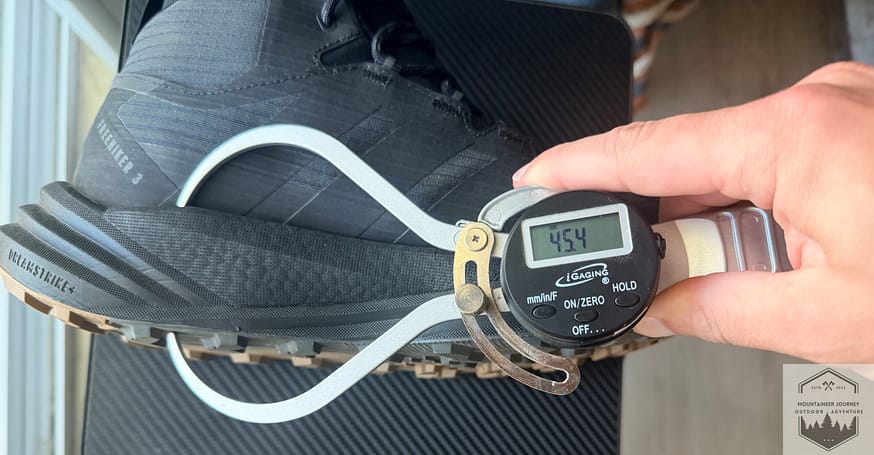 measuring heel stack on Terrex Free Hiker 3 at 45.4 with our digital caliper.