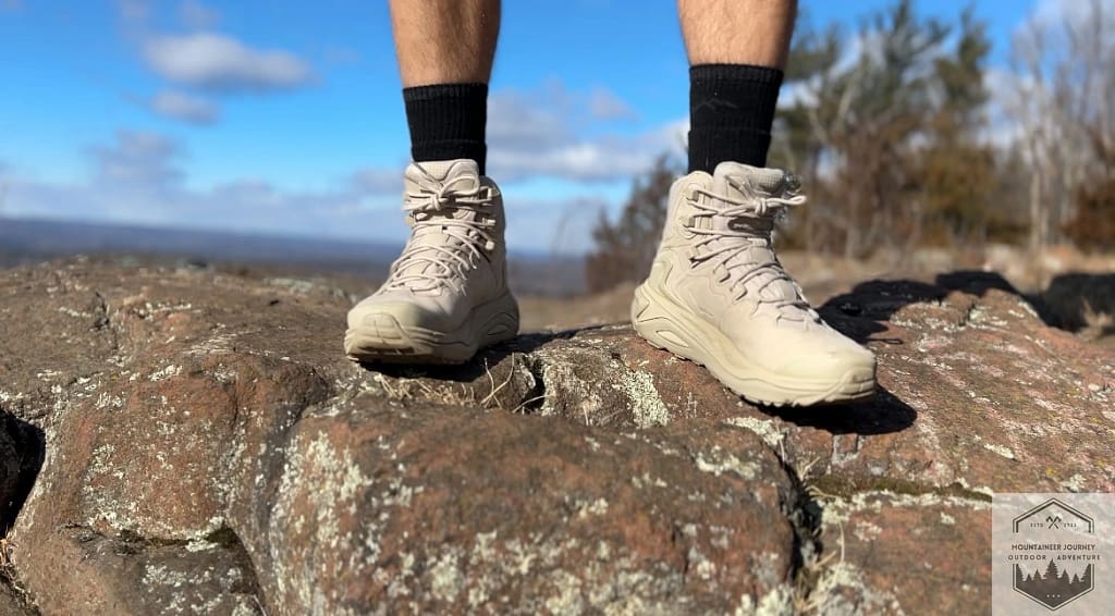 Wearing The Hoka Kaha 3's on a rock highlighting the front of the boots
