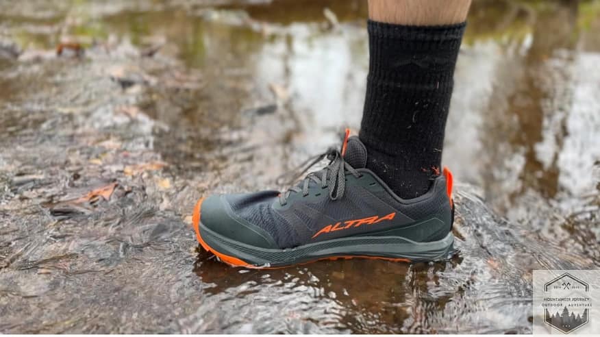 Measuring the flood height of the non-waterproof Altra Lone Peak 9+ in a shallow stream to determine water entry points.