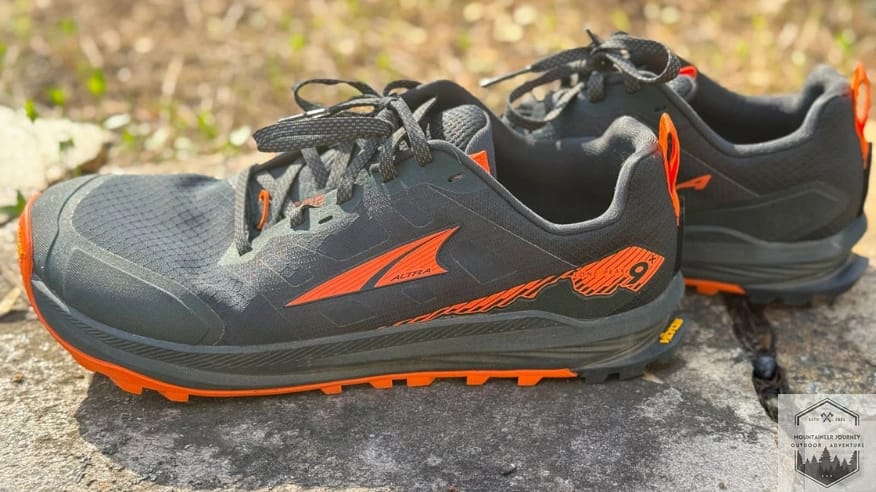 Full side view of Altra Lone Peak 9+ showing the seamless welded upper materials and the yellow Vibram Megagrip outsole logo.