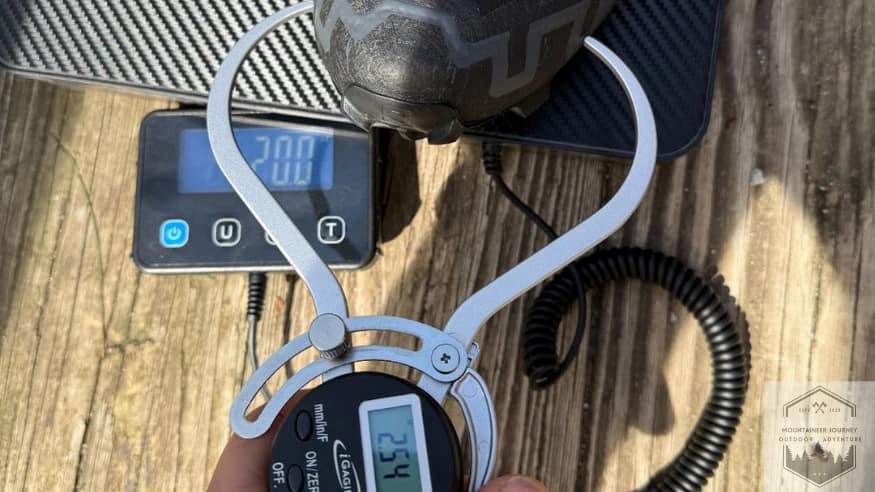 Measuring the Salomon Speedcross 6 toe box at 2.54 inches with a digital caliper, providing objective data on the shoe's narrow, precision-fit forefoot.