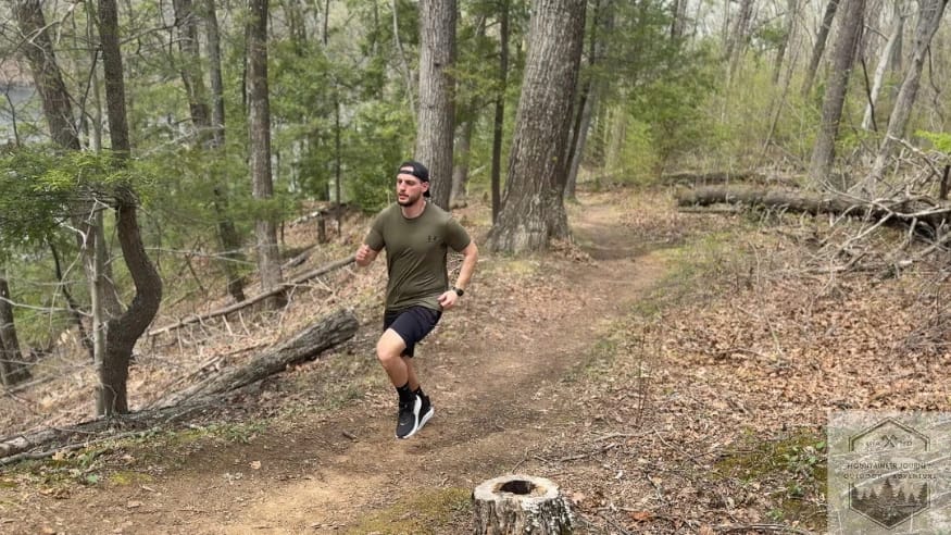 Uphill trail running in Hoka Clifton 10 to test ankle stability on uneven ground.