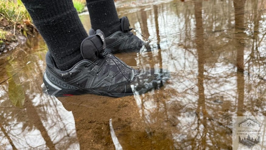Testing the waterproofness of the salomon speedcross 6 in a creek during our 10 minute submersion test