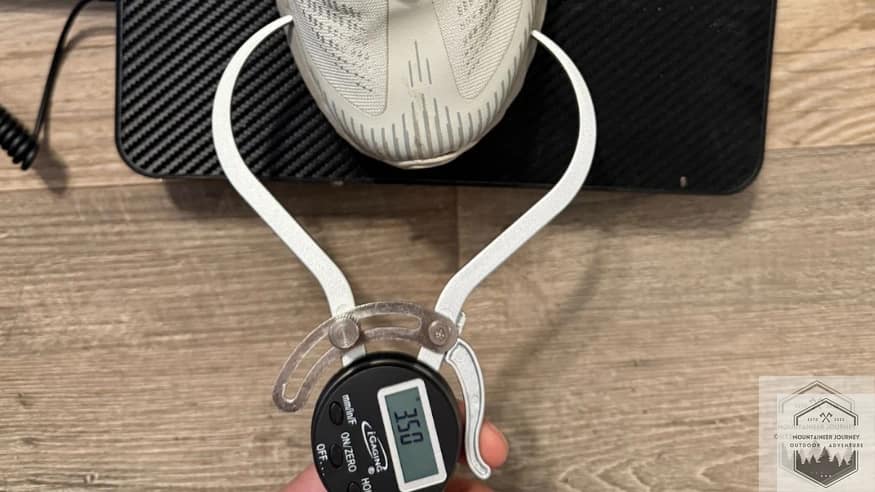 Measuring the Merrell Agility Peak 5 toe box width with a digital caliper at 3.50 inches to verify forefoot volume and fit.
