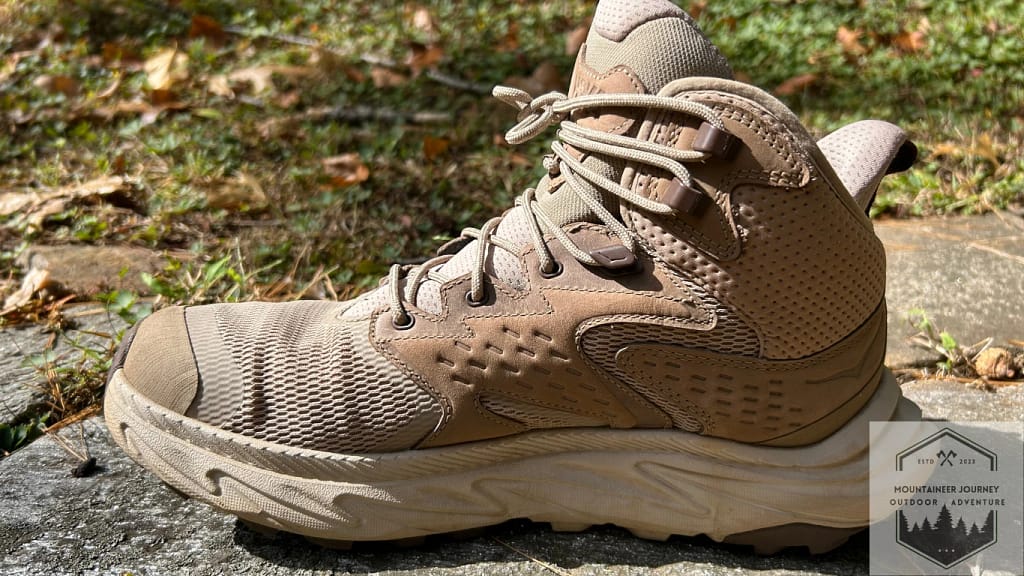 The Anacapa 2 is clearly the winner in this comparison. Boot on a wall behind grass.