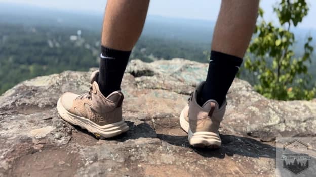 blog-img-1722538486153 Hoka Anacapa 2's used in summer at mountain summit showcasing it's ventilation at the top