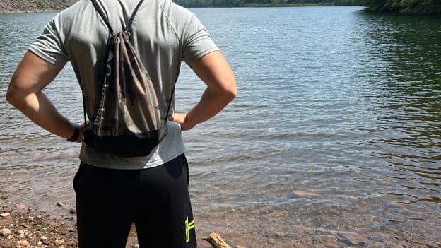 blog-img-1722538557836 Showcasing my personal summer hiking gear: Moisture wicking shirt, shorts, sunglasses, and backpack with proper hydration