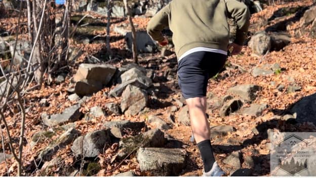 trail running with speedgoat up rocks