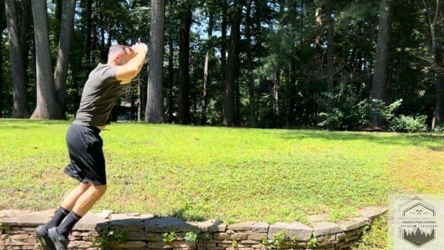performing a squat jump