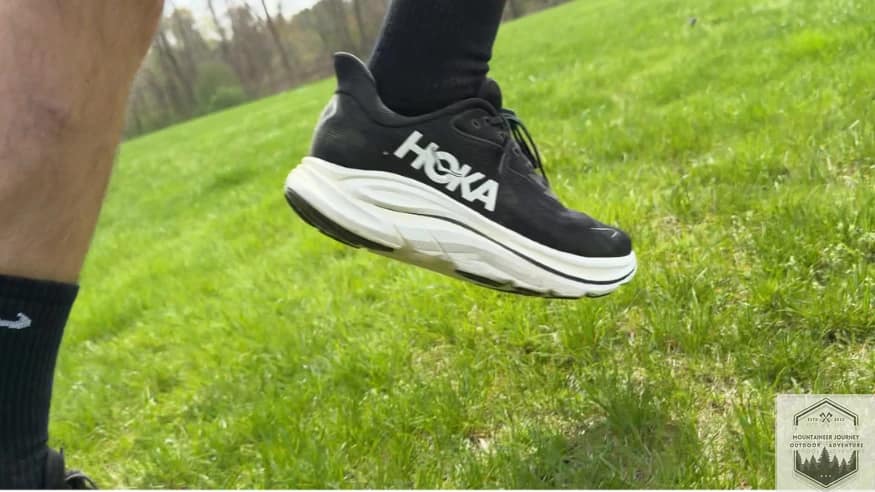 Hoka Clifton 10 running on grass to test versatility and stability on flat terrain