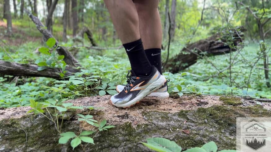 wearing the cascadia 18 on a log testing the midsole comfort