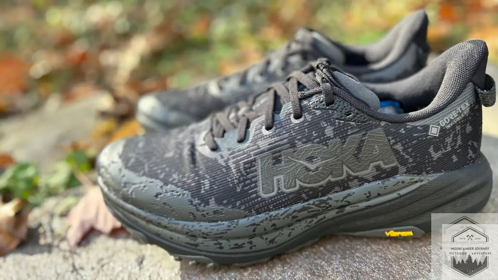 side view of the Hoka Speedgoat 6 on a wall