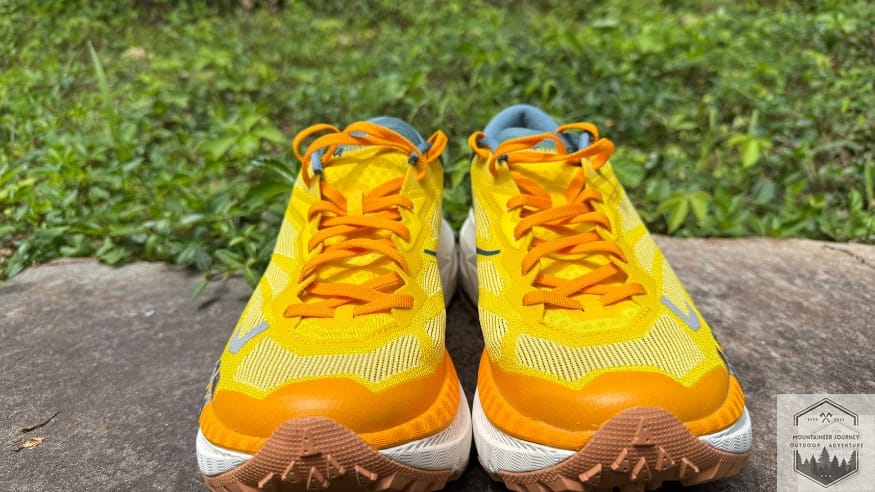 Front view of the Hoka Mafate X showing the wide-base midsole geometry and the protective toe cap on the high-stack trail shoe.