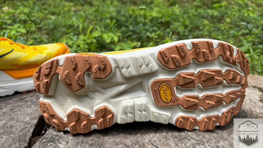 Bottom view of the Hoka Mafate X outsole featuring Vibram Megagrip rubber and 3.5mm lugs for lightweight trail performance.