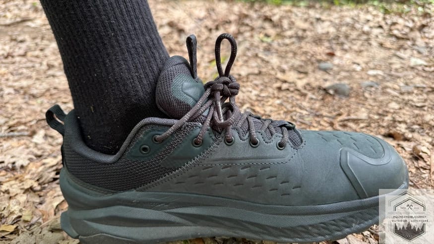 Ankle view of the Altra Olympus 6 highlighting the Original FootShape fit for natural toe splay and the plush, updated ankle collar for heel security.