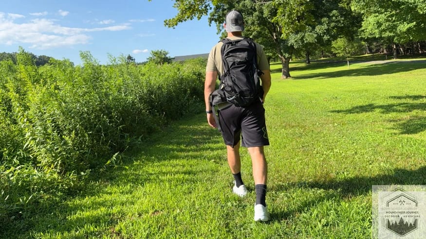 Testing the stability and grip of Brooks Ghost Max 2 shoes on a grassy surface.