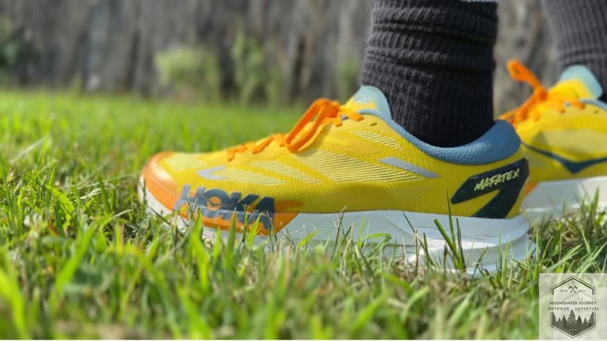 Bottom view of the Hoka Mafate X outsole featuring 3.5mm Vibram Megagrip lugs and a visible forked carbon fiber propulsion plate.