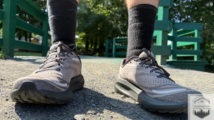 Front view of both shoes while standing in gravel