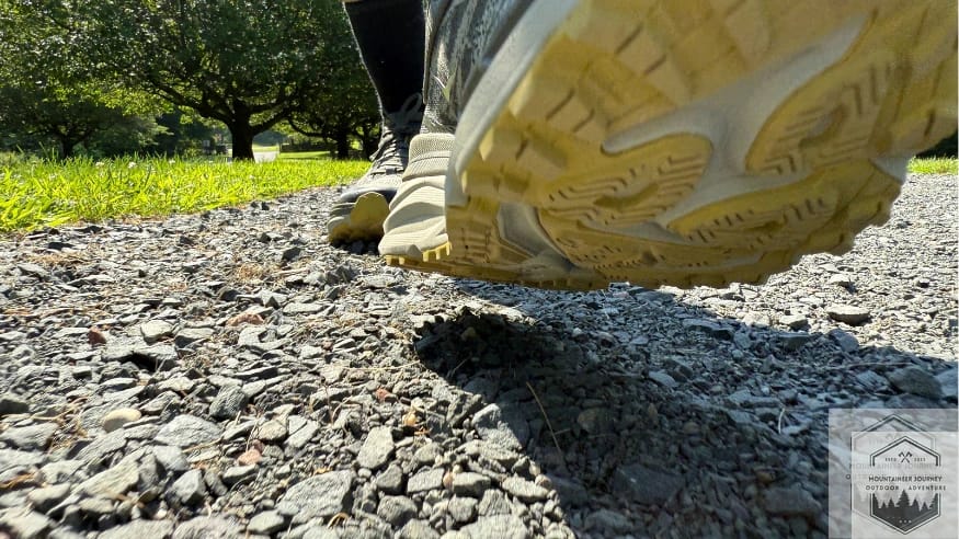Analyzing the Hoka Stinson 7's Durabrasion rubber and longitudinal decoupling groove during field testing on unstable gravel surfaces.