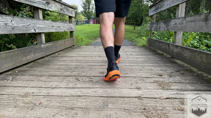 walking over a bridge during our testing of the Altra Experience Flow