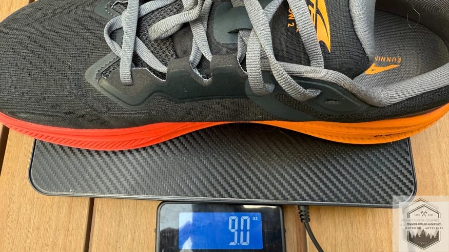 weighing the altra experience flow 2 on our scale at 9 ounces