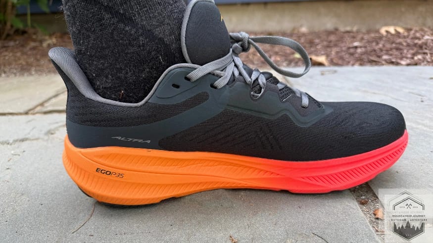 Full view of the Altra Experience Flow 2 on concrete during traction testing to evaluate the grip of the updated rubber outsole and rockered geometry