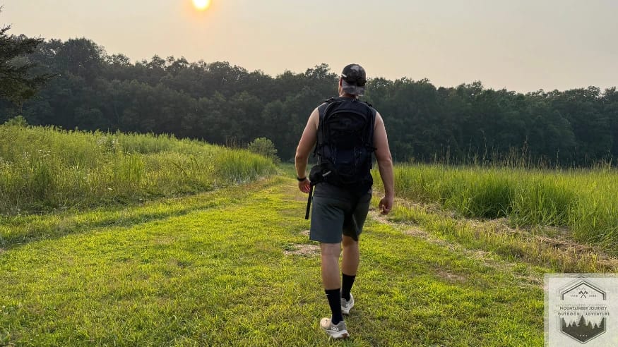 Walking in the Hoka Transport on grass with a 40lb backpack to test the stability and compression of the sugarcane EVA midsole under load