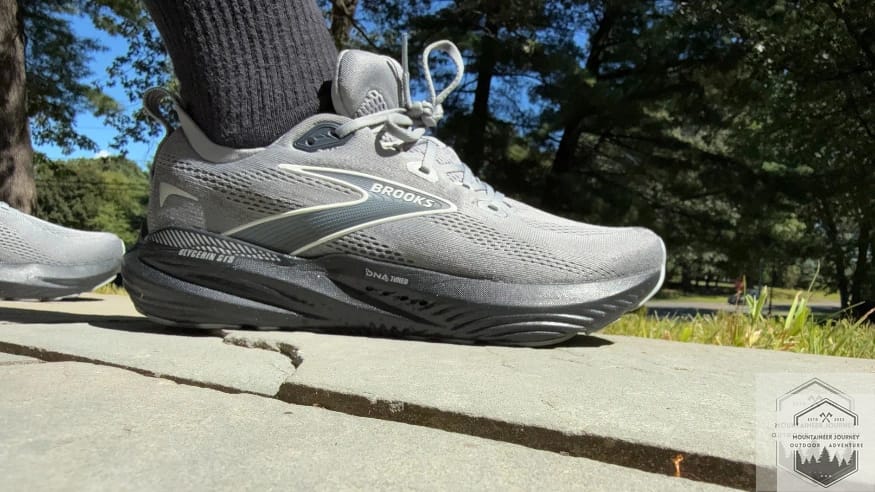 Close-up view of the Brooks Glycerin 22 lacing system showing a tight, snug fit for a secure midfoot lockdown during active road testing.