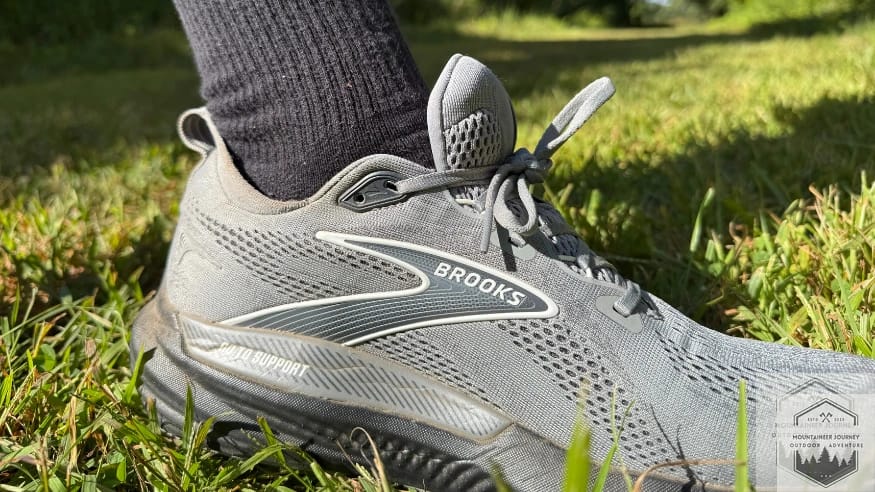 Testing the Brooks Glycerin 22 on a grassy field to demonstrate the versatility and traction of the RoadTack rubber outsole on soft surfaces