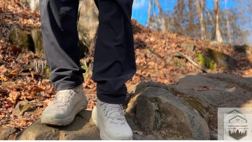 Standing on a rock during a trail hike with Hoka Kaha 3