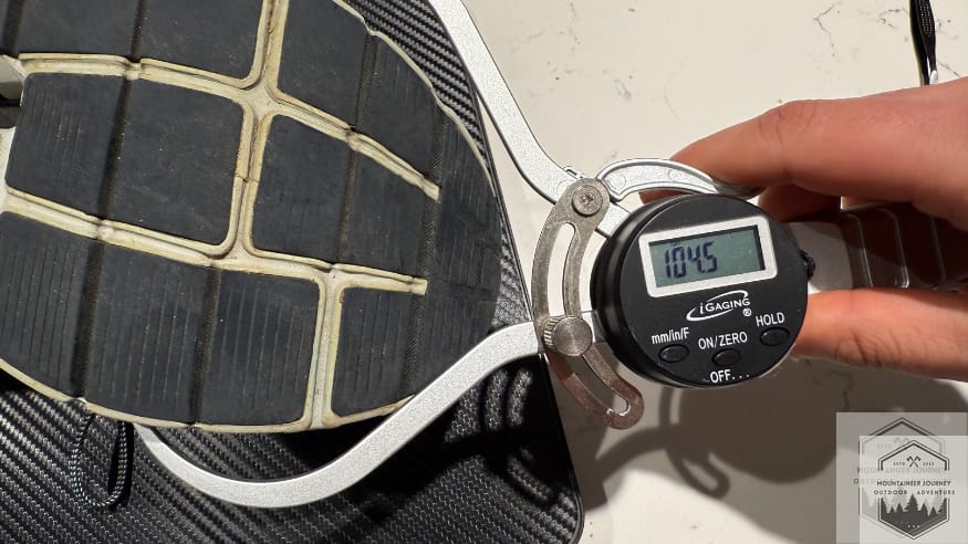 Measuring the On Cloud 6 forefoot width at 104 mm using a digital caliper to provide objective data on the shoe's midfoot volume and toe box space.