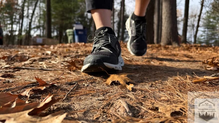 Testing the On Cloud 6 traction on a leaf-covered sidewalk to evaluate the grip of the CloudTec rubber pods on slick, organic surfaces.