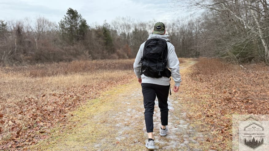 Testing Brooks Agilent 24 GTS for impact absorption on dirt-covered trail.