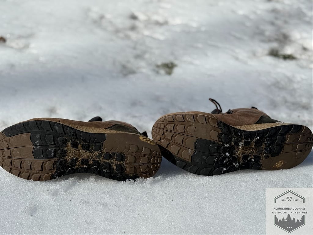 View of the Columbia Newton Ridge Plus II outsole after 5 years of use, showing wear and breakdown of the lugs, as well as flattening of the outsole