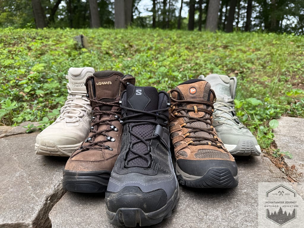 5 Different hiking boots on a wall. Showing the different types of materials and makeup of each