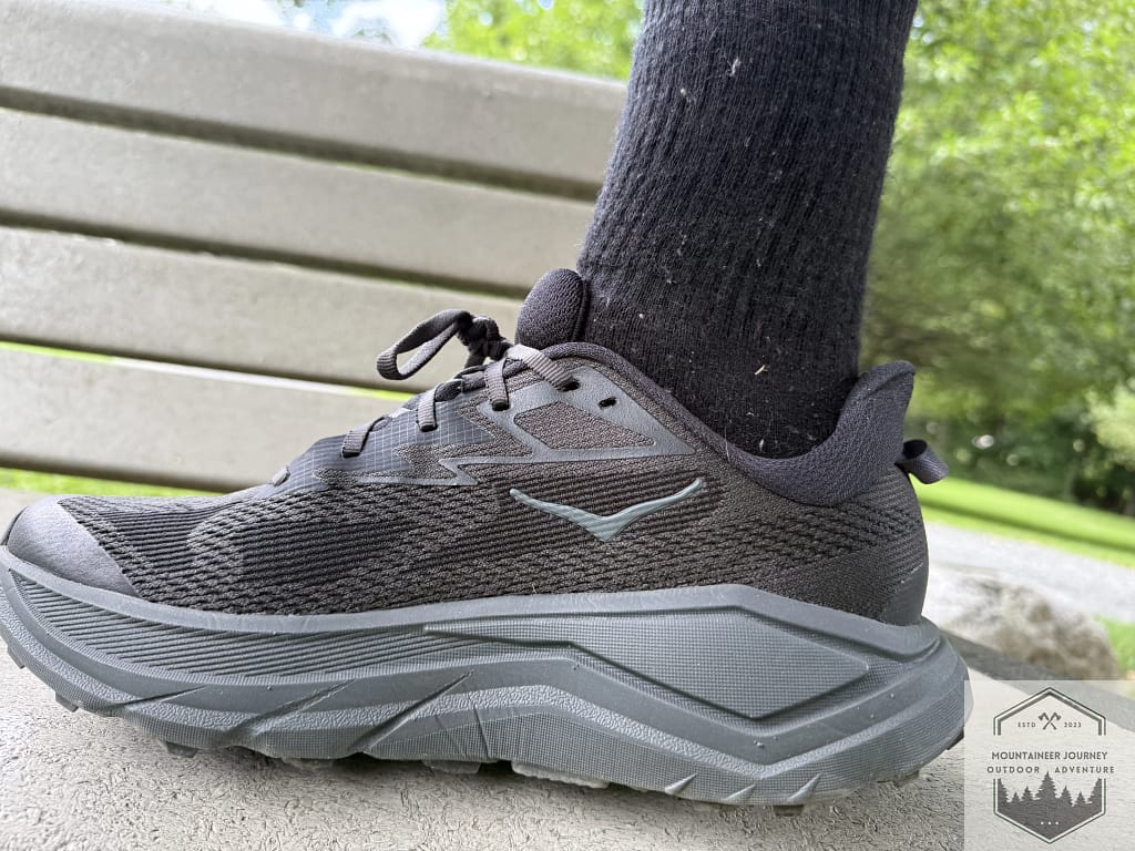 Side view of the Hoka Challenger 8 on a bench, highlighting the maximalist CMEVA foam stack height and the signature Meta-Rocker geometry for a smooth gait.
