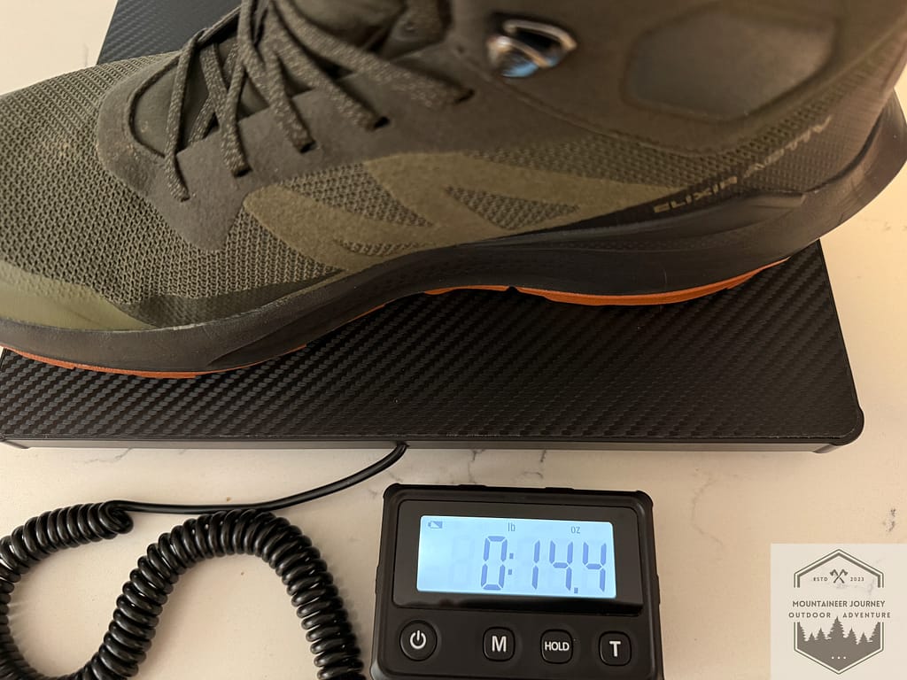Salomon Elixir Activ on our scale weighing 14 ounces per boot
