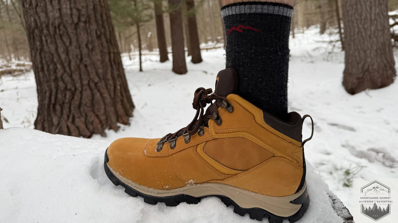 Entire Side View Of Timberland Mt Maddsen resting on a rock surrounded wit h snow