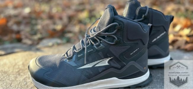 The Altra Lone Peak ALL-WTHR 2 side view on a stone wall