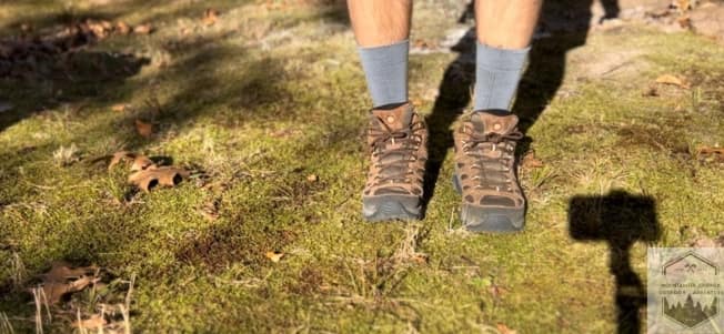 Farm To Feet Damascus Light Cushion while wearng hiking boots in the grass